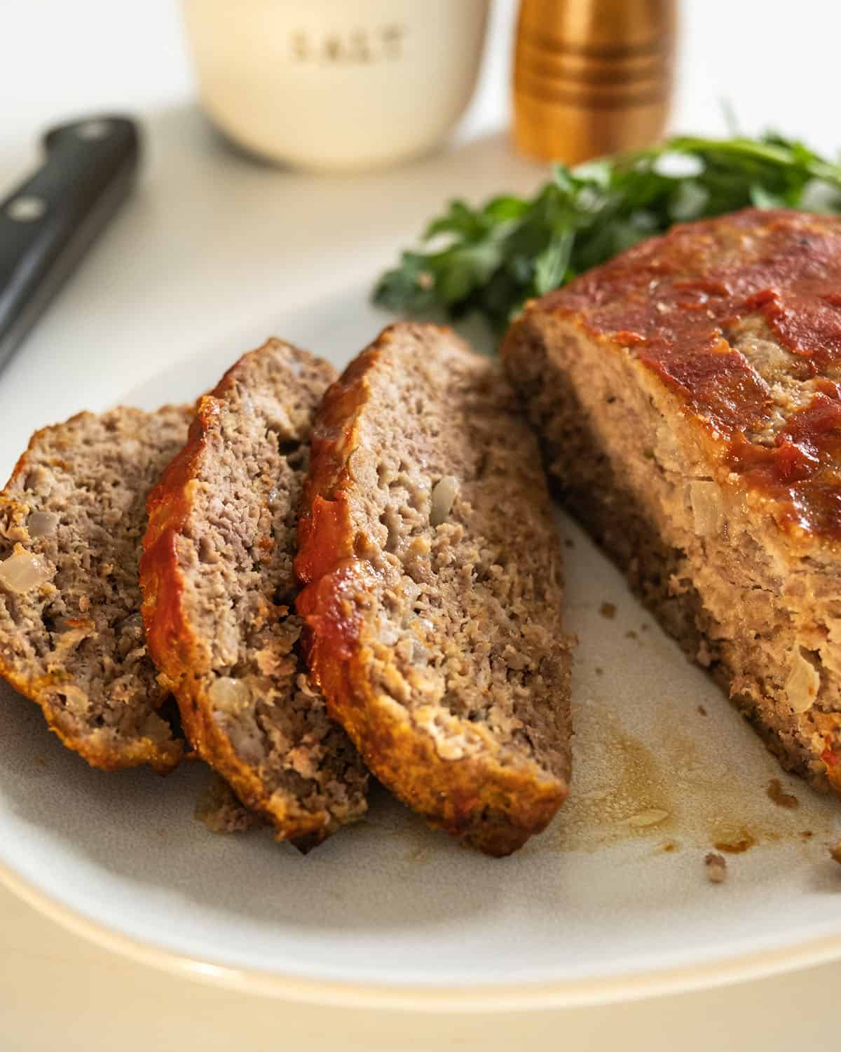 Italian meatloaf sliced on a plate.
