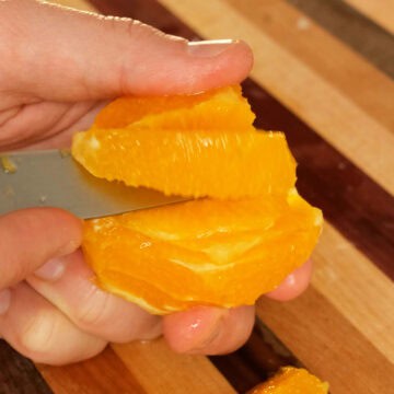 Slicing an orange.