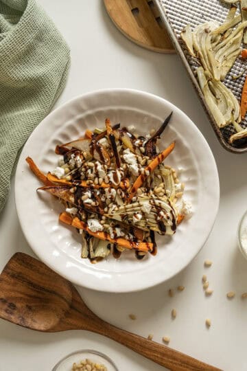 Roasted Carrots and fennel topped with pine nuts and balsamic glaze.