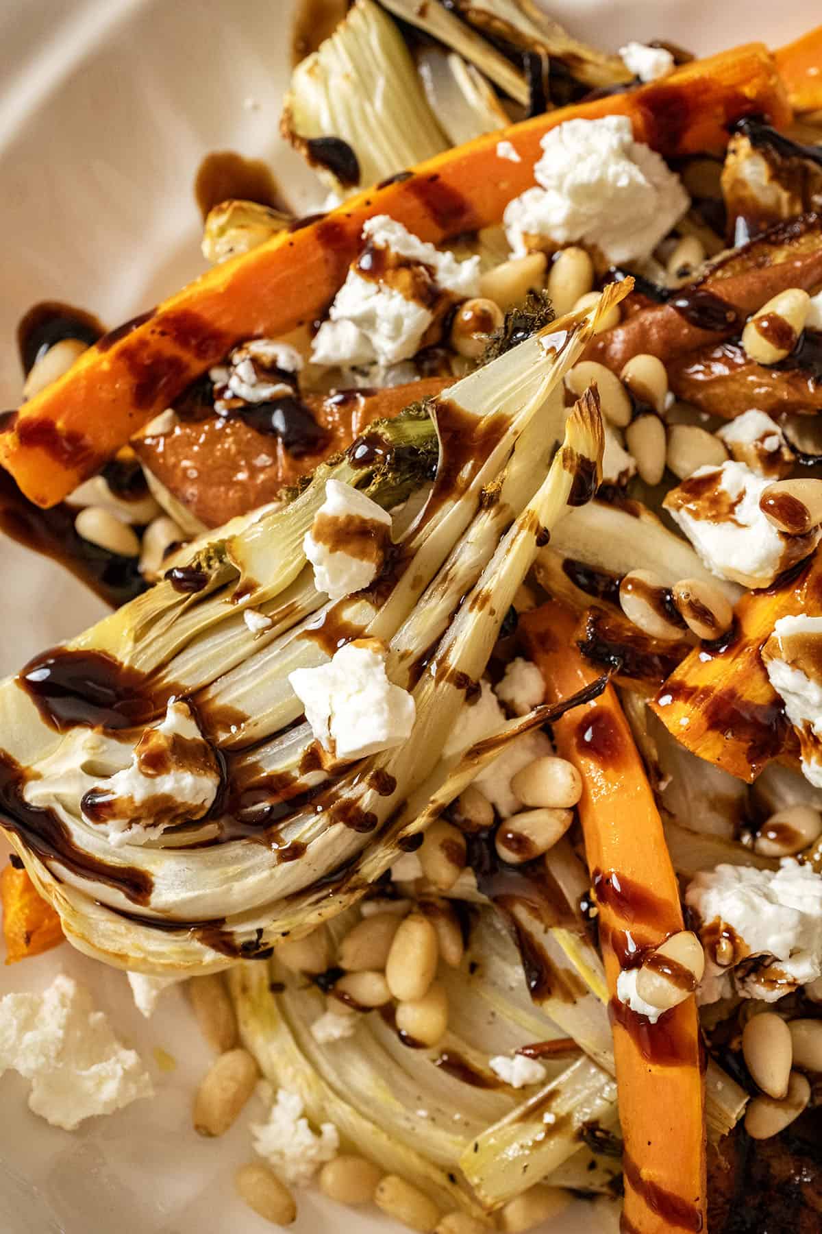 Roasted Carrots and fennel topped with pine nuts and balsamic glaze.