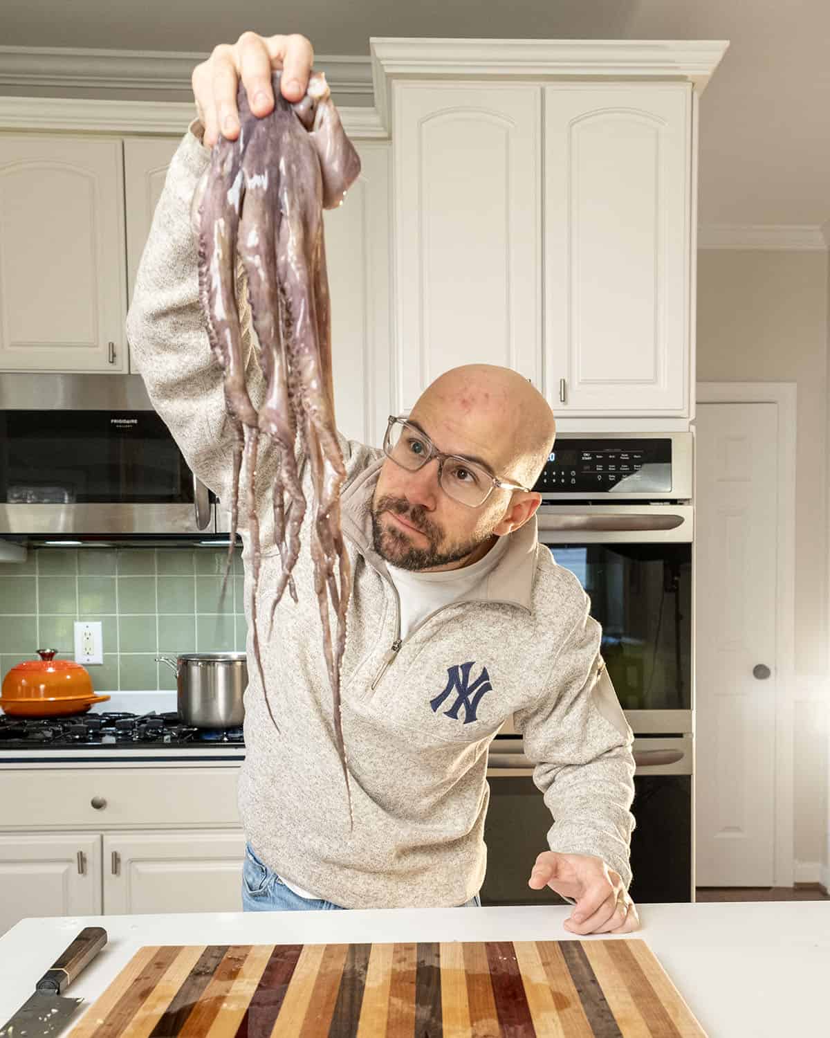 The author holding a raw octopus.