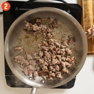 Sausage browned in a saucepan.