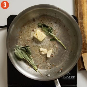 Butter, sage, and garlic in a pan.