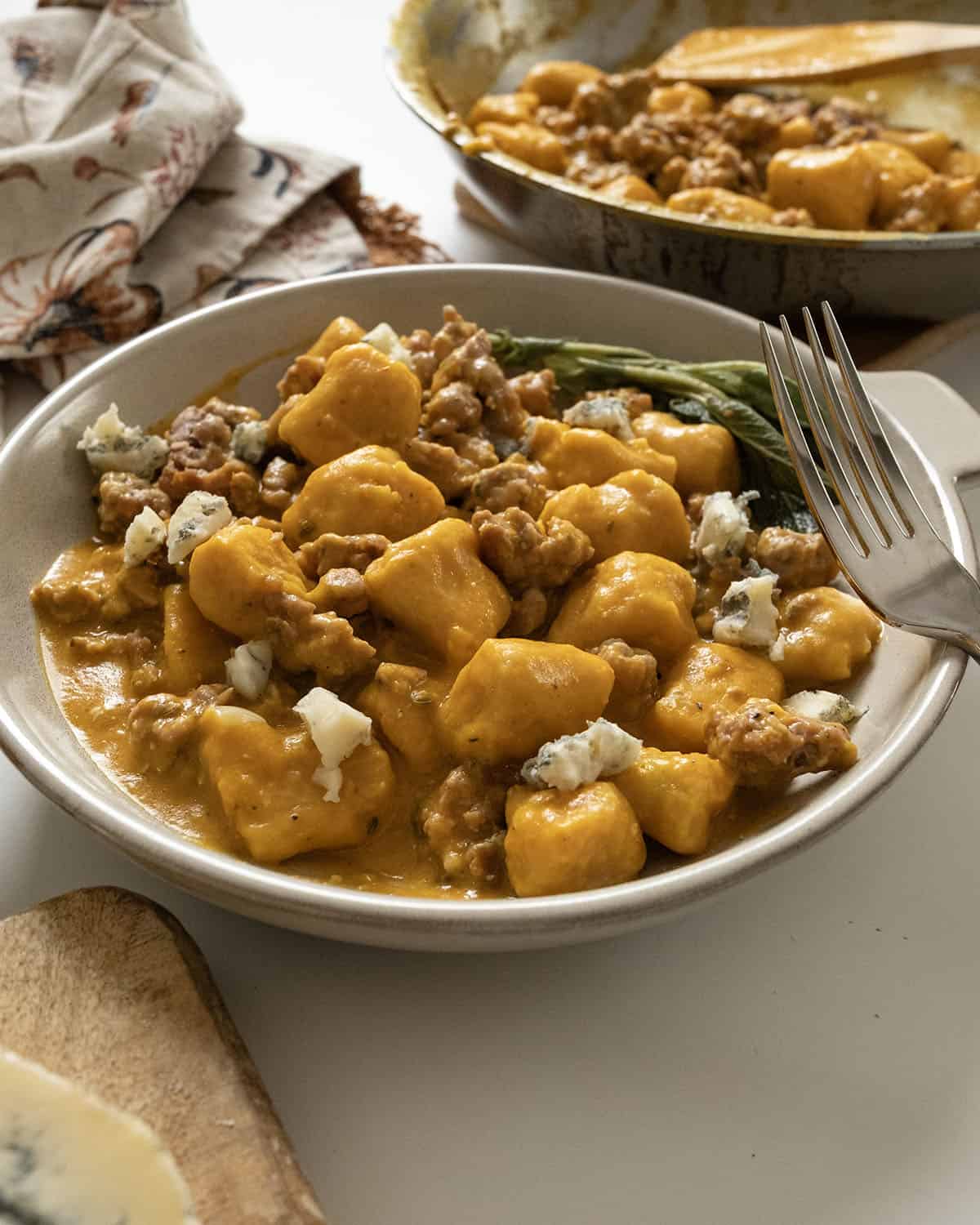 Gnocchi with pumpkin sauce and sausage.