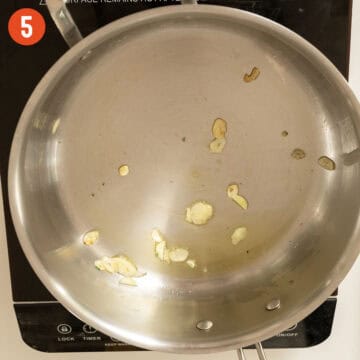 Sauteing garlic in olive oil.