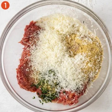All ingredients for meatballs in a bowl.