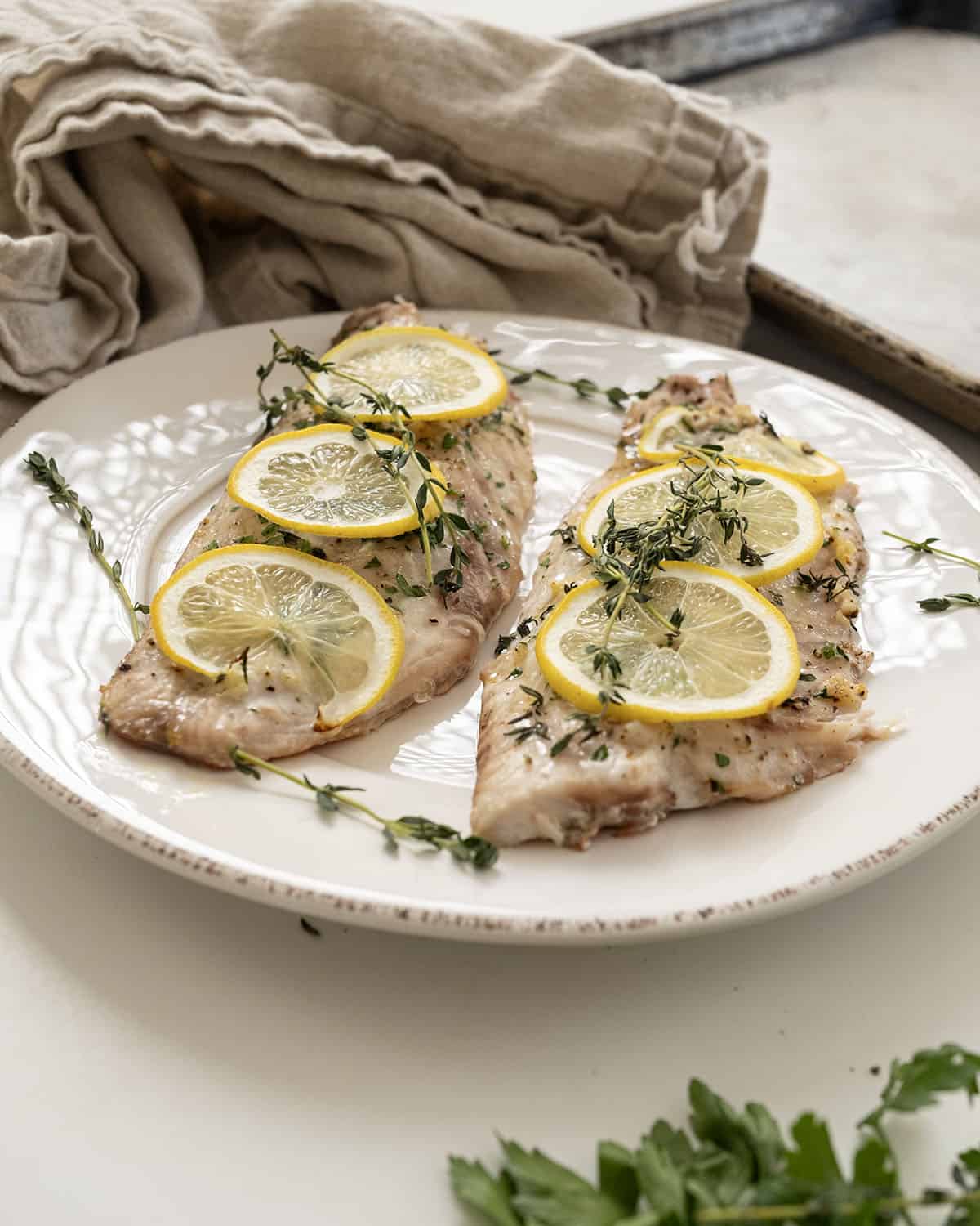 Baked red snapper topped with lemon and thyme.
