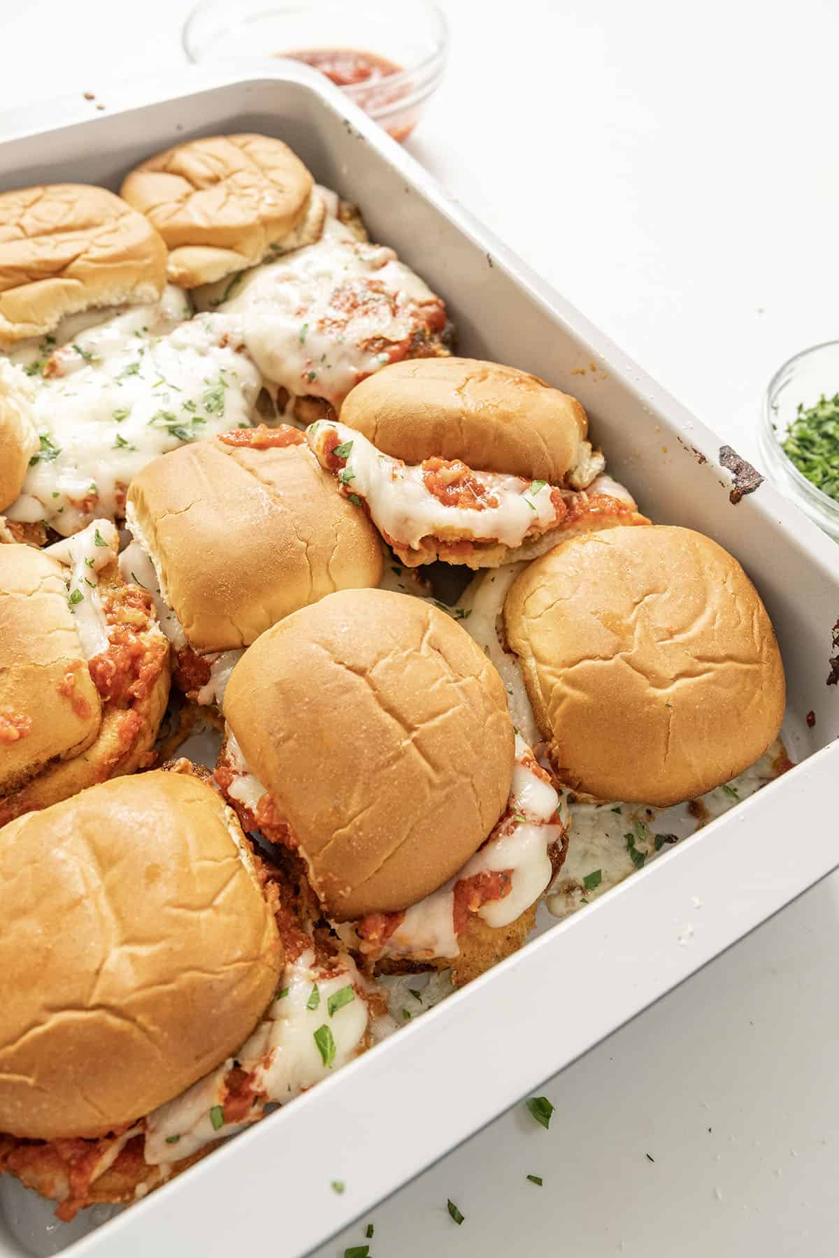 Chicken parm sliders in a tray.