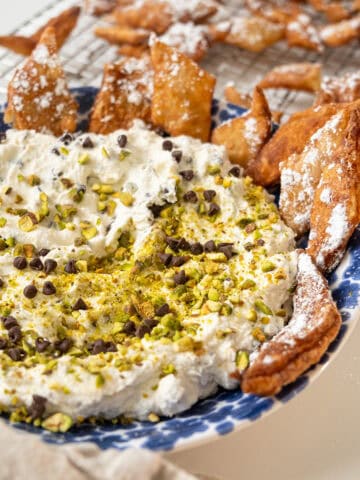 Homemade cannoli dip and chips in a dish.