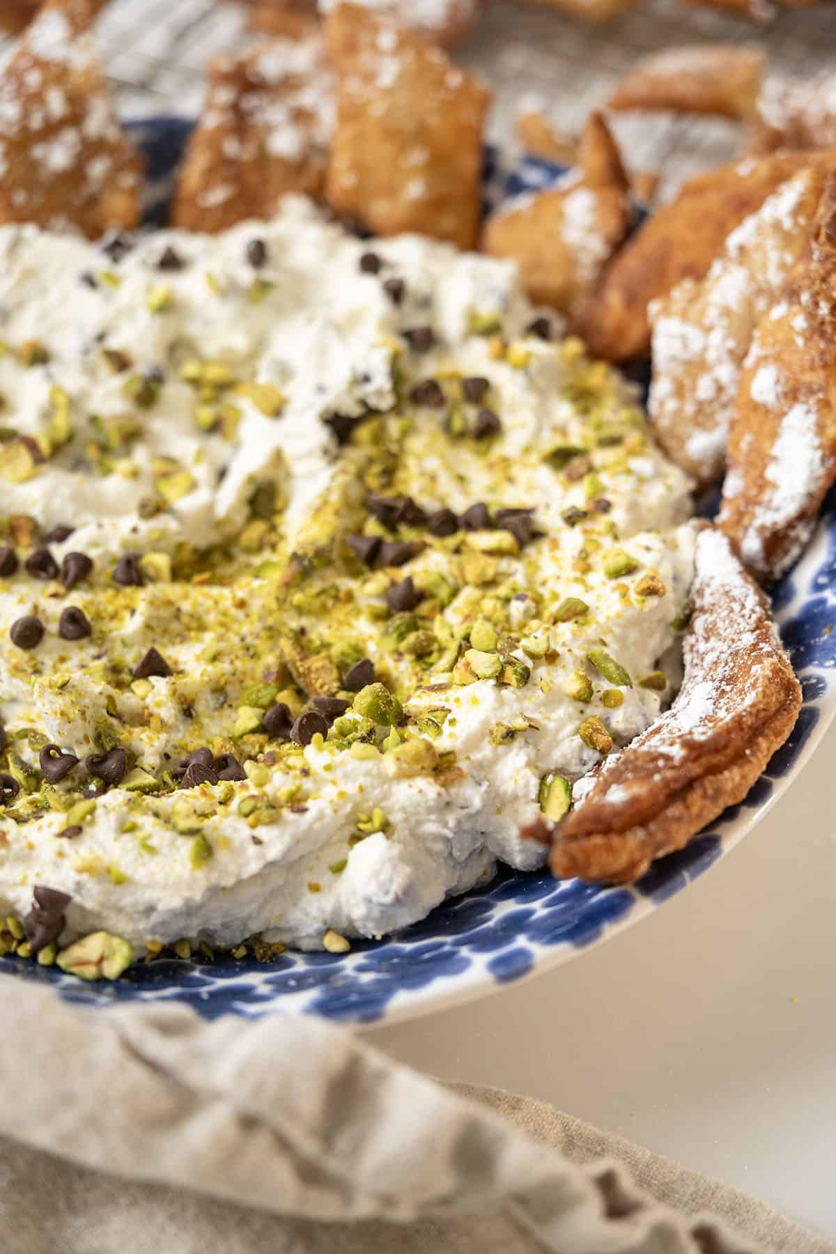 Homemade cannoli dip and chips in a dish.