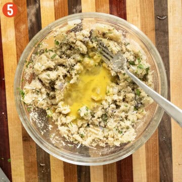 Combining egg with eggplant mixture.