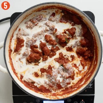Adding heavy cream to the sauce.