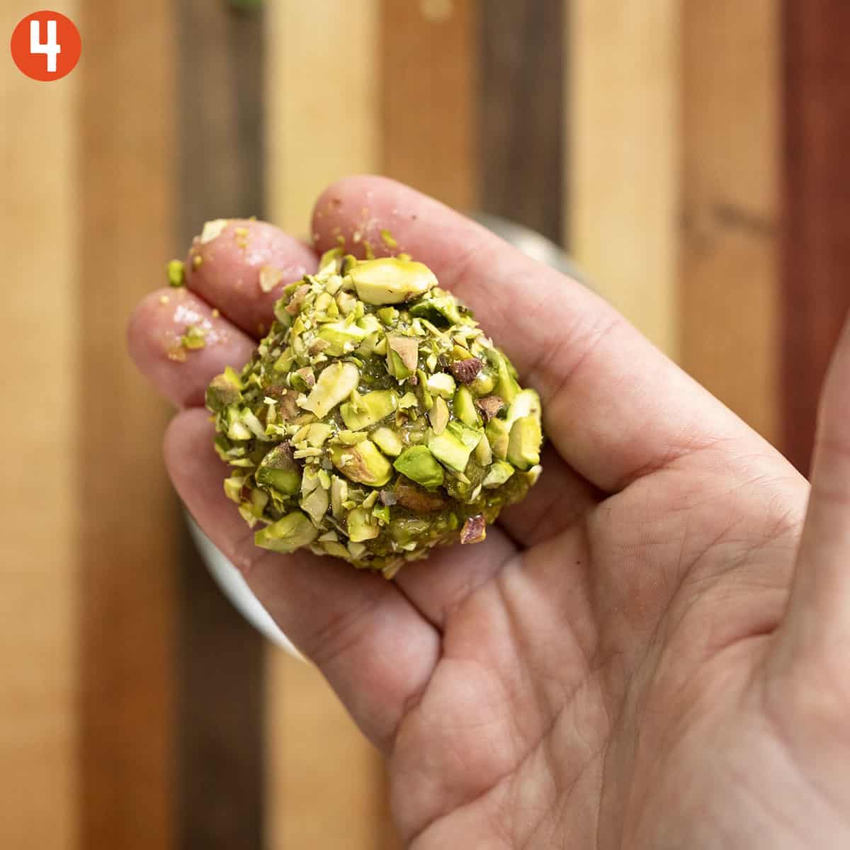 Rolled pistachio dough rolled in chopped pistachio.
