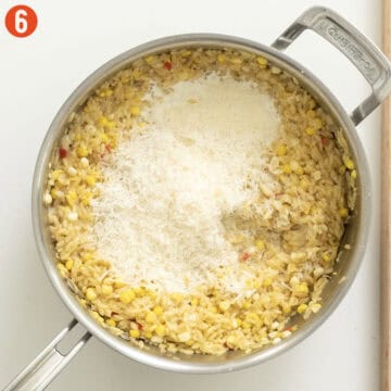 Corn Orzo combined with parmigiano in a saucepan.