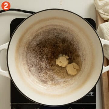 Melting lard in a dutch oven.