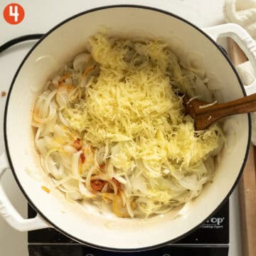 Grated potatoes and calabrian chili peppers added to the softened onions.