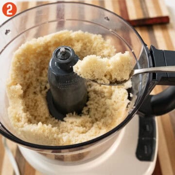 Almond paste and granulated sugar in a food processor.