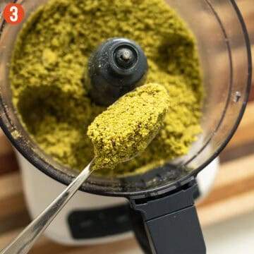 Grinding pistachios in a food processor.