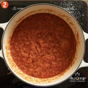 Crushed tomatoes coming to a simmer.
