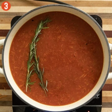 Chicken stock added to the pot.