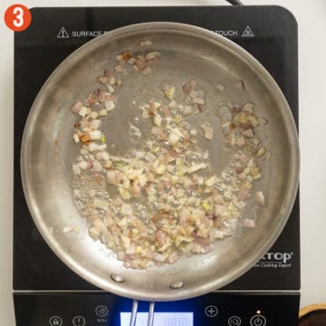 Sauteing shallots and garlic in butter.