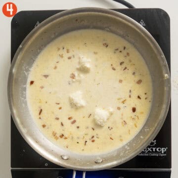 Cream, parmigiano, and mascarpone combined in pan.