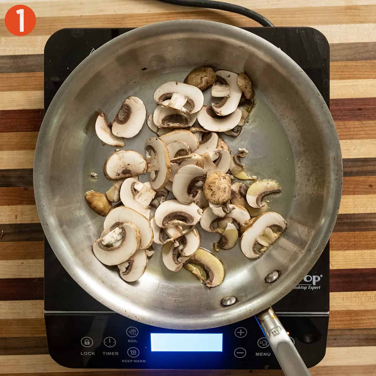 Sauteing mushrooms in a saucepan.