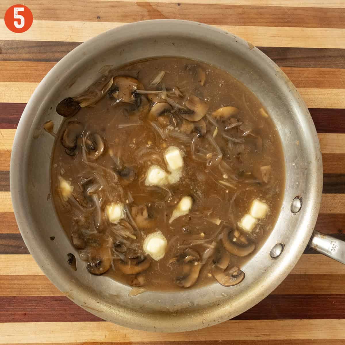 Emulsifying butter in the gravy.