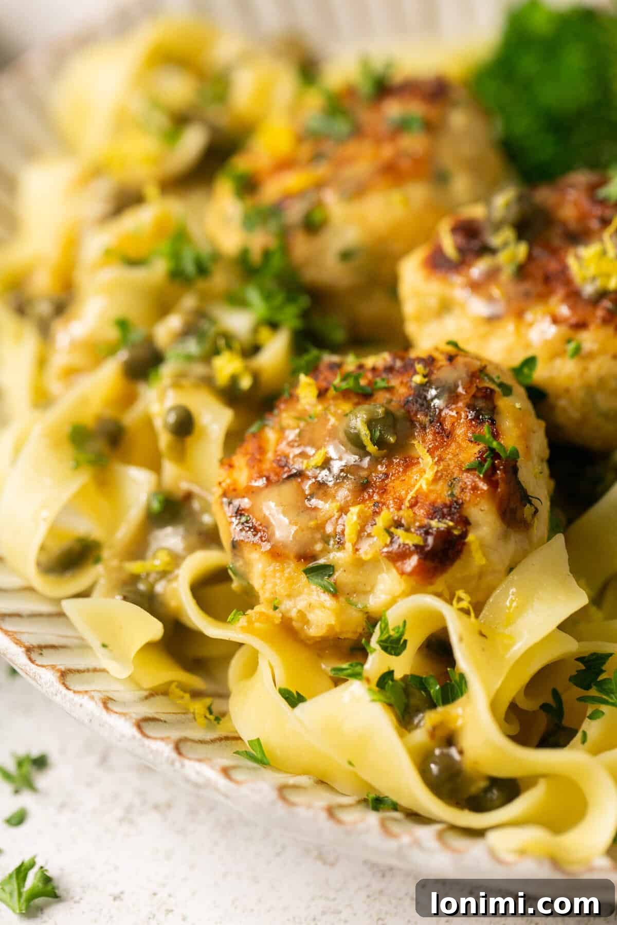 close up of chicken meatballs with pasta 