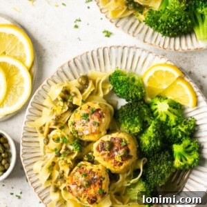 gluten free chicken piccata meatballs with pasta and broccoli and lemon on 2 plates