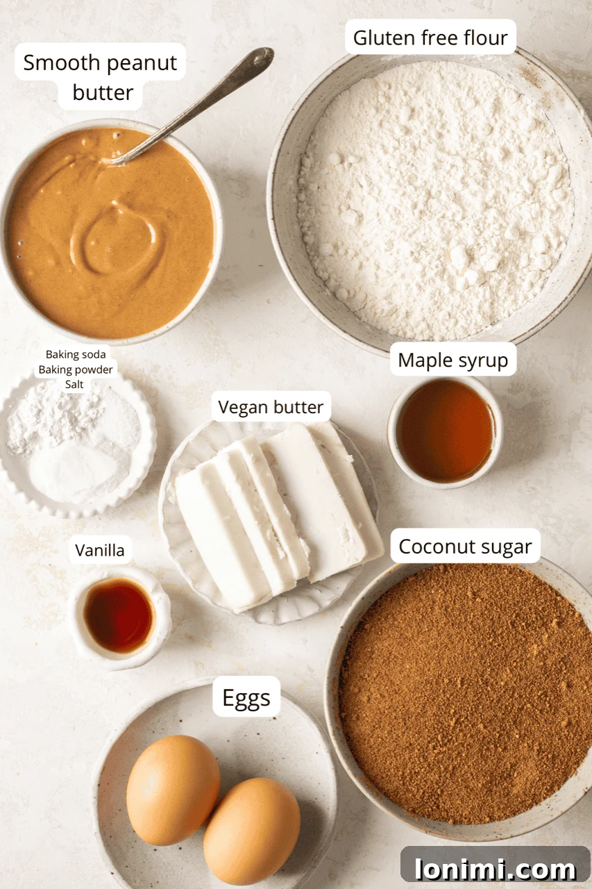 Mary's Signature Gluten-Free Peanut Butter Cookies 3 A collection of organized recipe ingredients, including creamy peanut butter, various sugars, and gluten-free flour, neatly arranged in nesting bowls and labeled for easy identification, set against a rustic background.