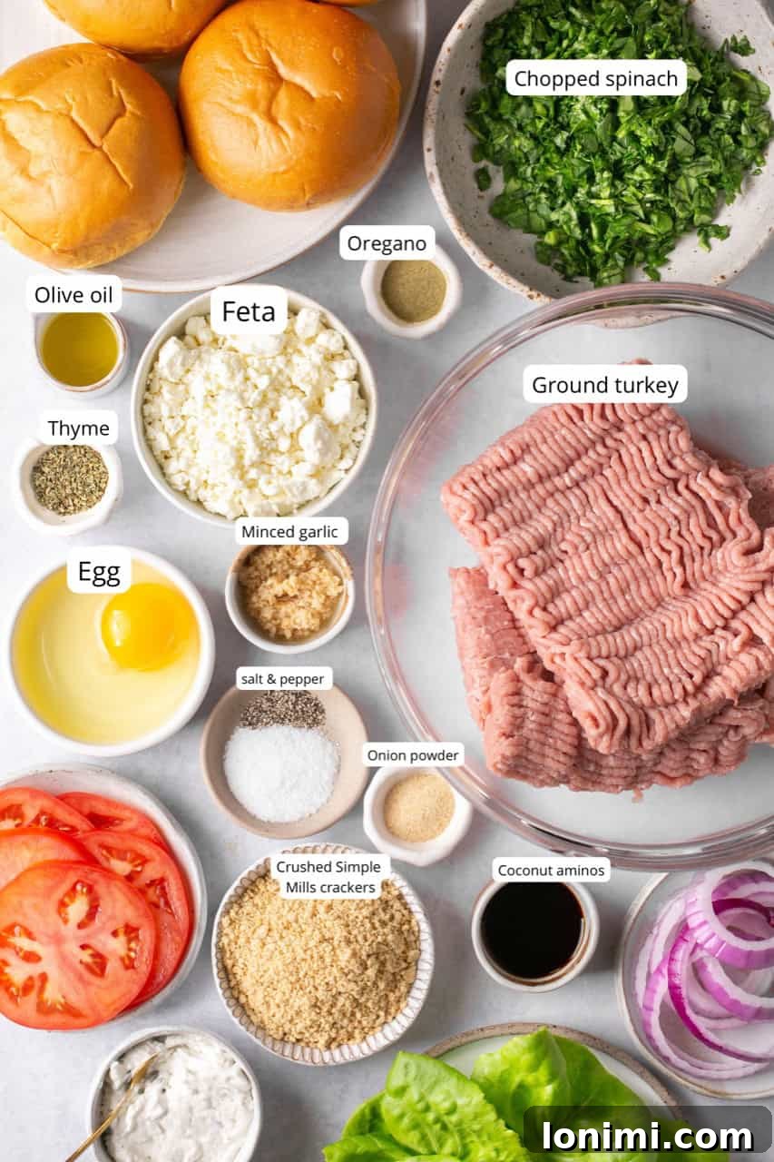 Flavorful Air-Fried Turkey Burgers with Spinach and Feta 3 A selection of fresh ingredients laid out for making air fryer turkey burgers, including ground turkey, spinach, feta cheese, and various spices.