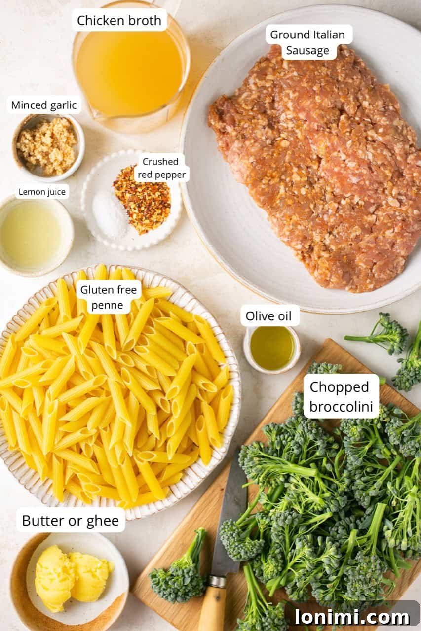 Ingredients for sausage broccolini pasta laid out in various bowls
