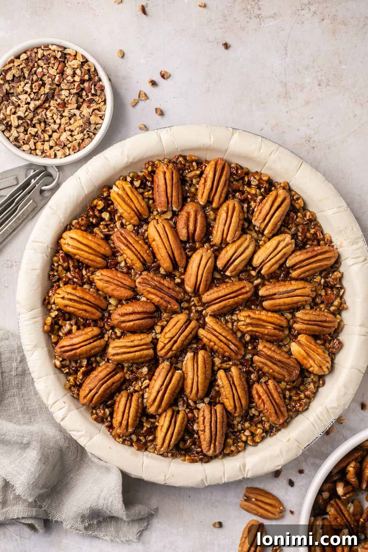 An inviting overhead shot of a freshly baked gluten-free pecan pie without corn syrup, showcasing its golden crust and rich, nutty filling.
