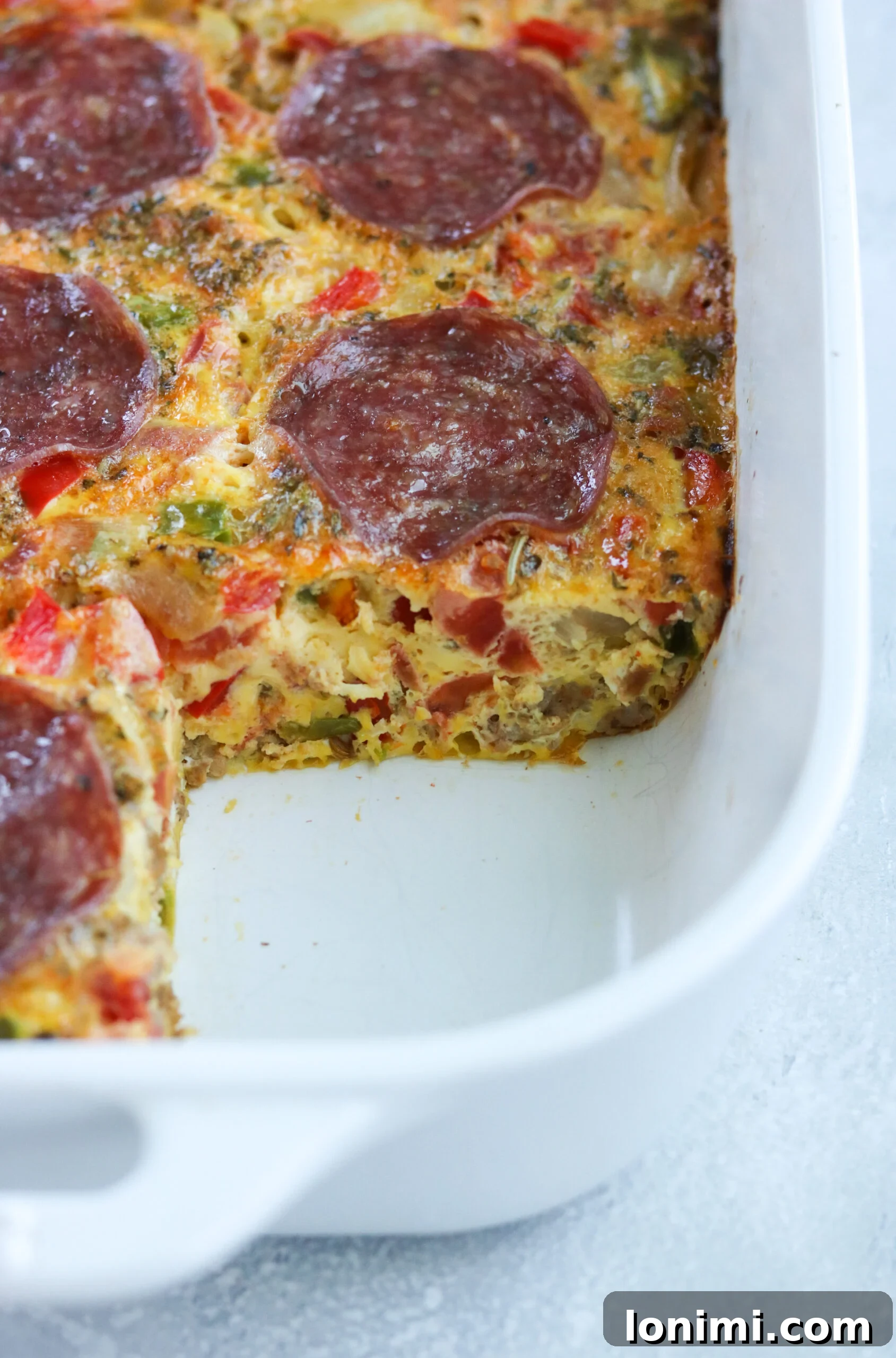 Morning Pizza Bake 3 Close-up of baked Paleo Pizza Breakfast Casserole with fresh herbs