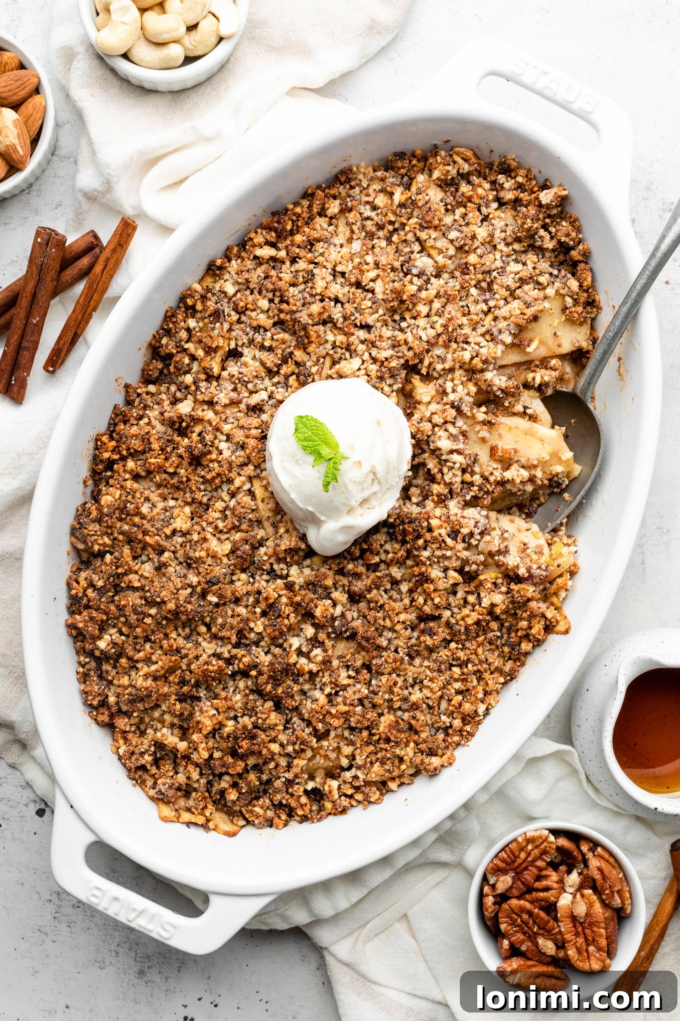 Close-up of a Paleo Apple Crisp with a golden-brown topping, ready to be served.