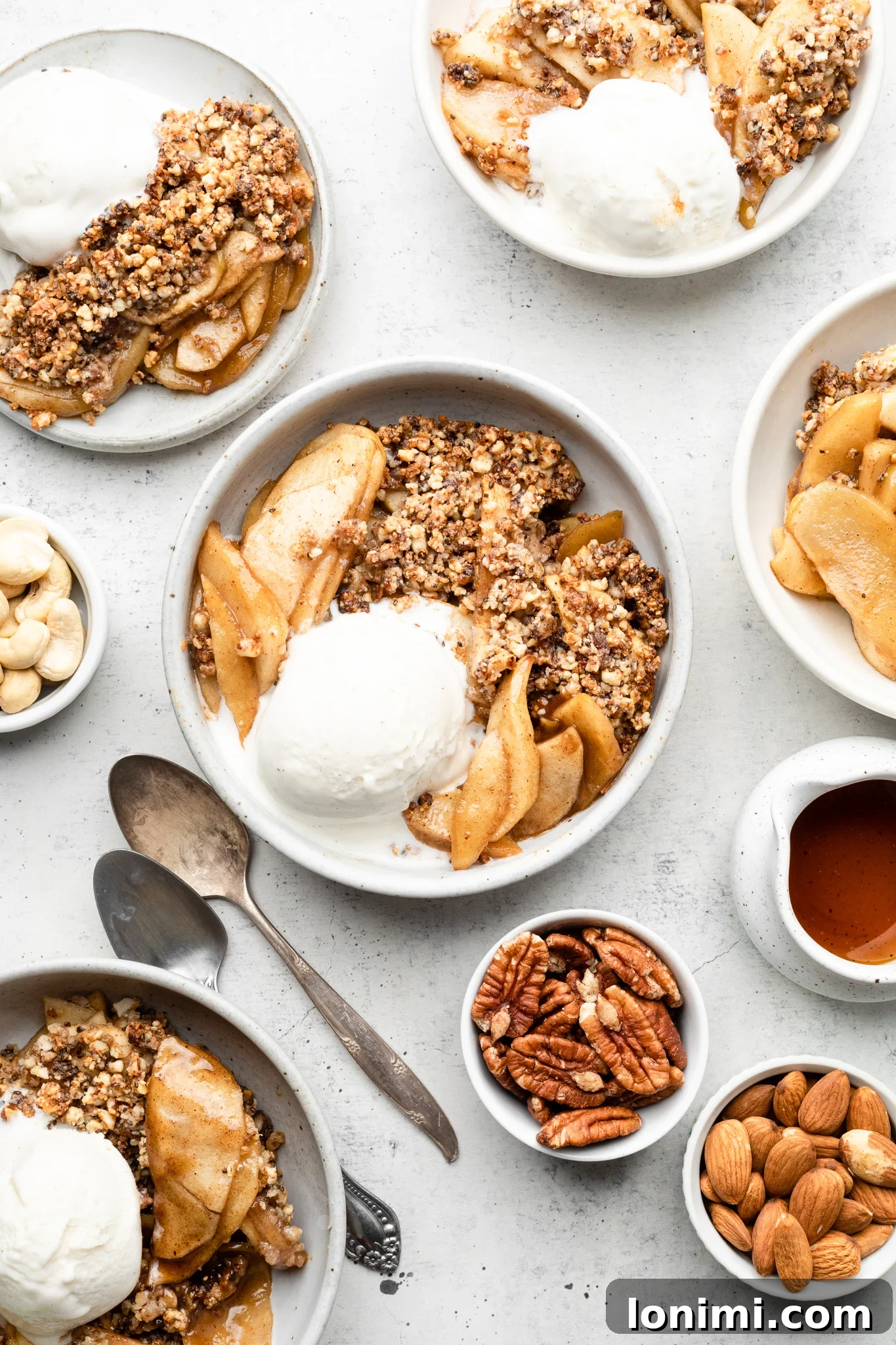 Paleo Apple Crisp baking in a casserole dish, bubbling at the edges.