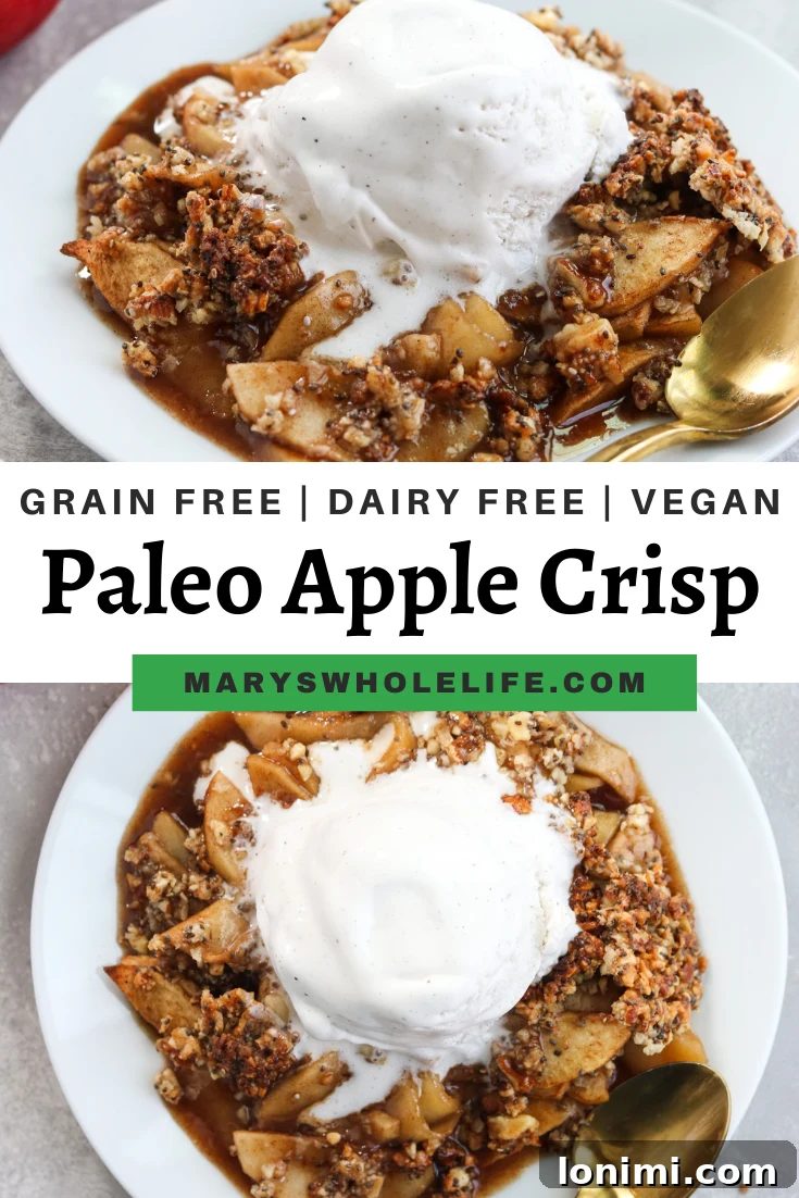 A beautifully styled flat lay of a Paleo Apple Crisp in a white serving dish, surrounded by autumn leaves and spices.