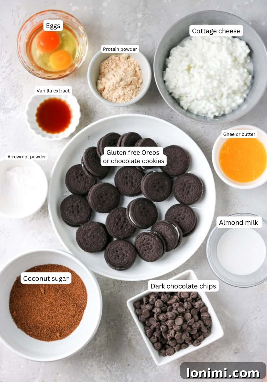 Effortless Chocolate Protein Cheesecake Bliss 3 recipe ingredients in nesting bowls and labeled