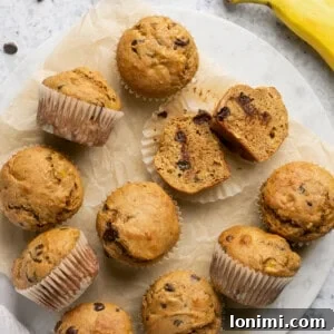 banana protein muffins on a piece of parchment paper