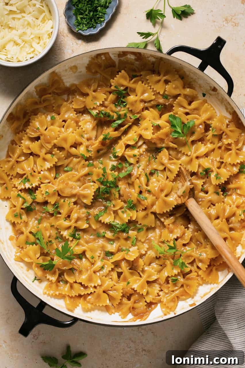 Gluten Free French Onion Pasta The TikTok Sensation 2 A pot of French onion pasta, garnished with fresh parsley, ready to be served.
