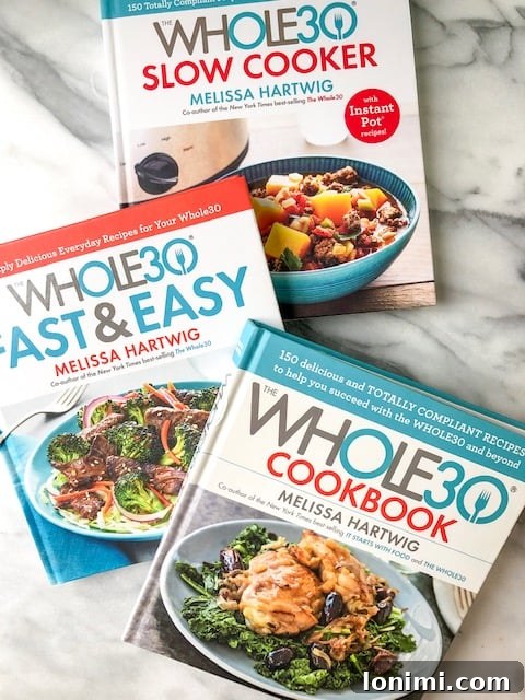 Your Roadmap to Whole30 Success 3 A curated collection of essential Whole30 books, providing knowledge and recipes for a successful program completion.