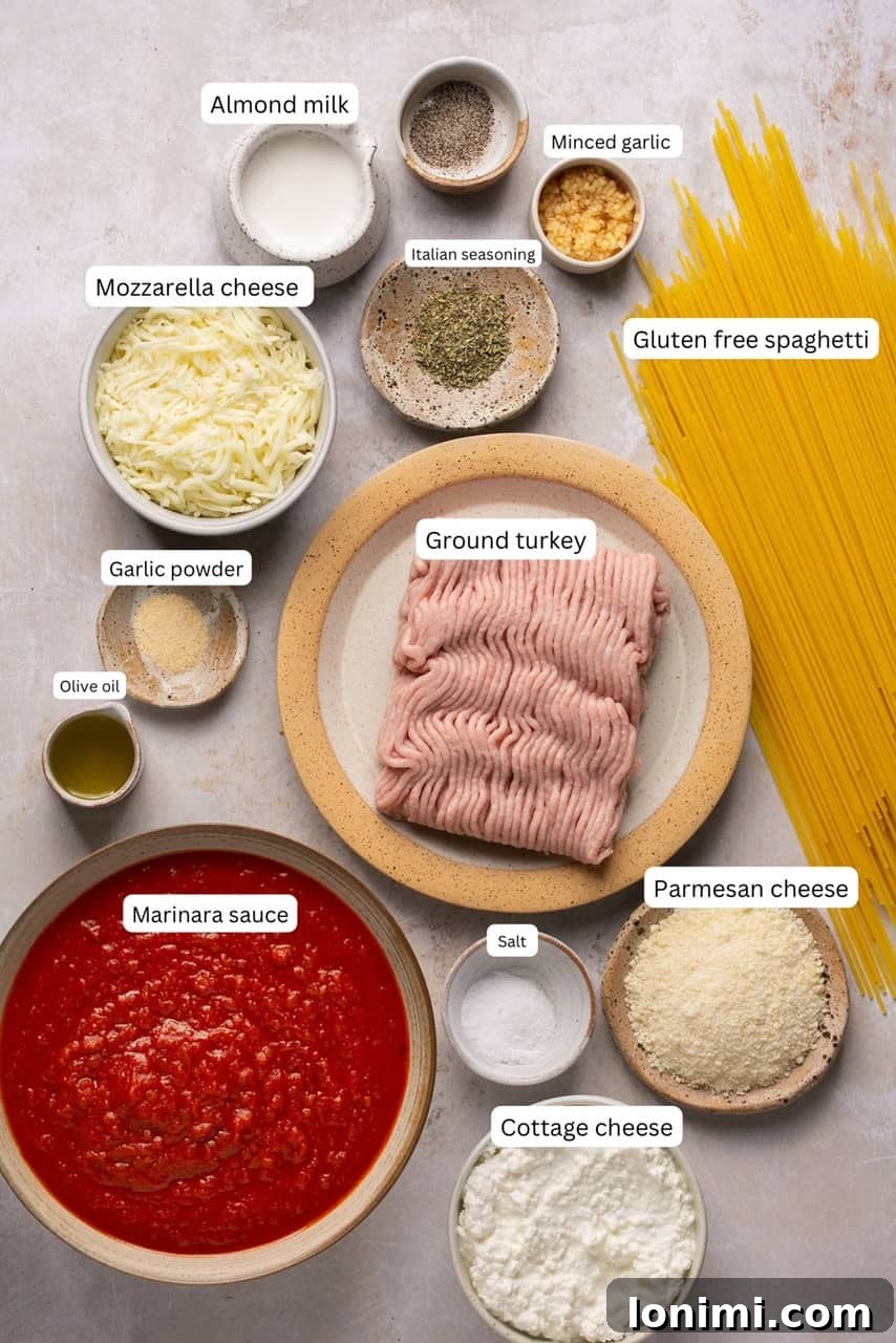 Individual recipe ingredients laid out in small bowls and clearly labeled for a gluten-free spaghetti alfredo recipe.