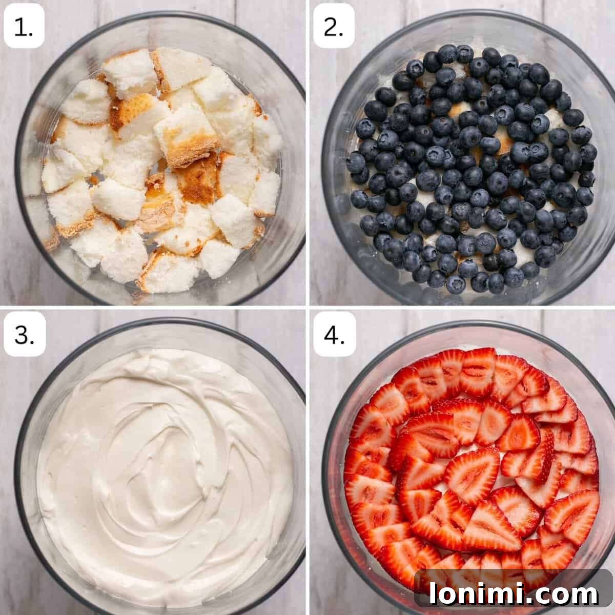 Heavenly Gluten-Free Strawberry Angel Food Trifle 5 Two hands carefully adding the first layer of cubed angel food cake to the bottom of a large glass trifle dish, as part of the step-by-step layering process for a berry trifle.