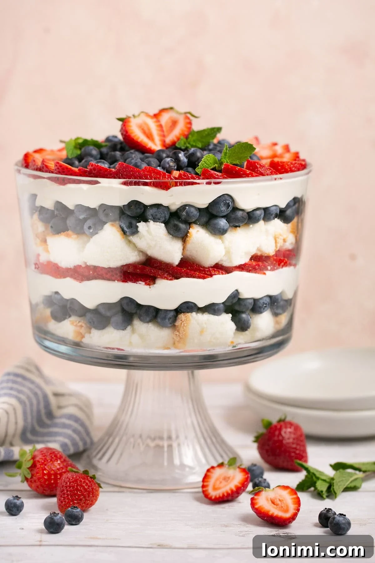 Heavenly Gluten-Free Strawberry Angel Food Trifle 9 A simple slice of gluten-free angel food cake on a white plate, highlighting its light and airy texture.