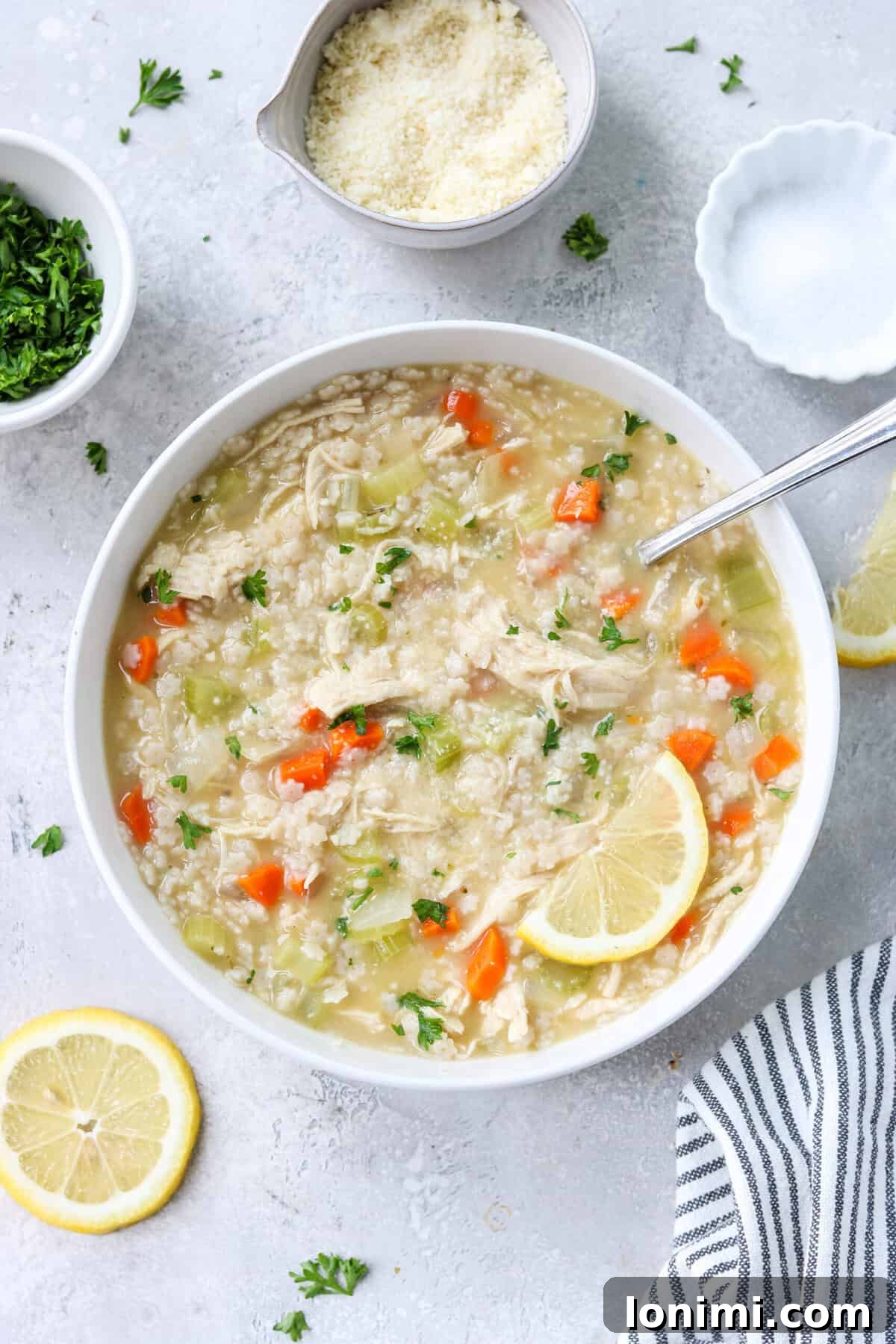 Comforting Gluten-Free Chicken Pastina Soup 2 gluten free chicken pastina soup in a bowl topped with parsley