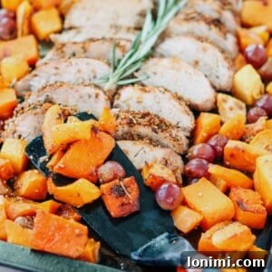 Sheet Pan Pork Tenderloin with Squash and Grapes cooked to perfection.