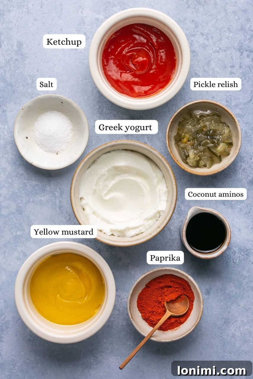 Gluten-Free Big Mac Secret Sauce 3 A selection of ingredients for healthy Big Mac sauce, including Greek yogurt, ketchup, mustard, relish, and spices, arranged on a countertop.