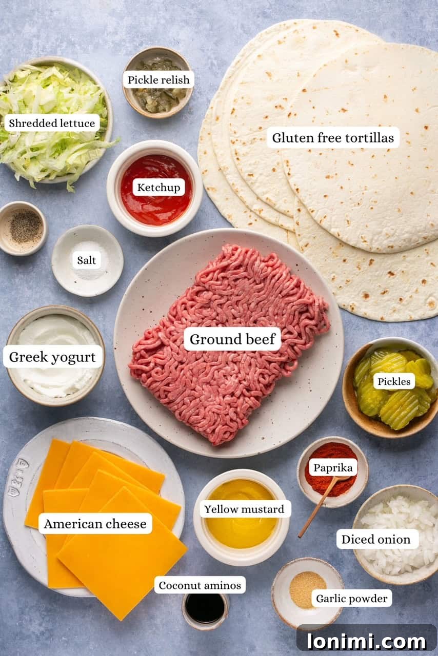 Ingredients for Big Mac tacos arranged in bowls, including ground beef, tortillas, American cheese, lettuce, pickles, onions, and sauce ingredients.
