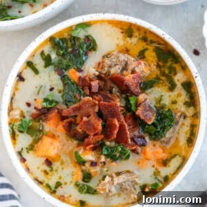Hearty Whole30 Paleo Gluten Free Zuppa Toscana 9 Whole30 Zuppa Toscana in a white bowl topped with bacon and parsley